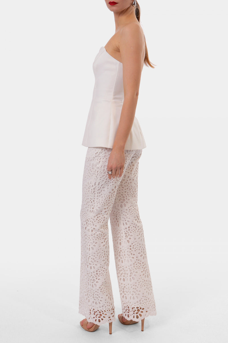 Off-white LAMIA corset top by AGGI by HALEWSKI featuring structured design and adjustable straps on a neutral background.