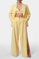 AGGI by Halewski OMENA Butter Yellow Pants, stylish casual pants with a relaxed fit, shown on a model.