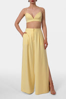 Yellow OMENA Butter Pants by AGGI by HALEWSKI, featuring a relaxed fit and stylish design, shown on a model.