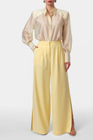 AGGI by Halewski OMENA butter yellow pants showing a relaxed fit, with a smooth fabric and stylish design.