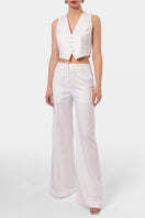 Off-white AGGI by Halewski Franzi pants with a relaxed fit and subtle pocket details, styled on a model.