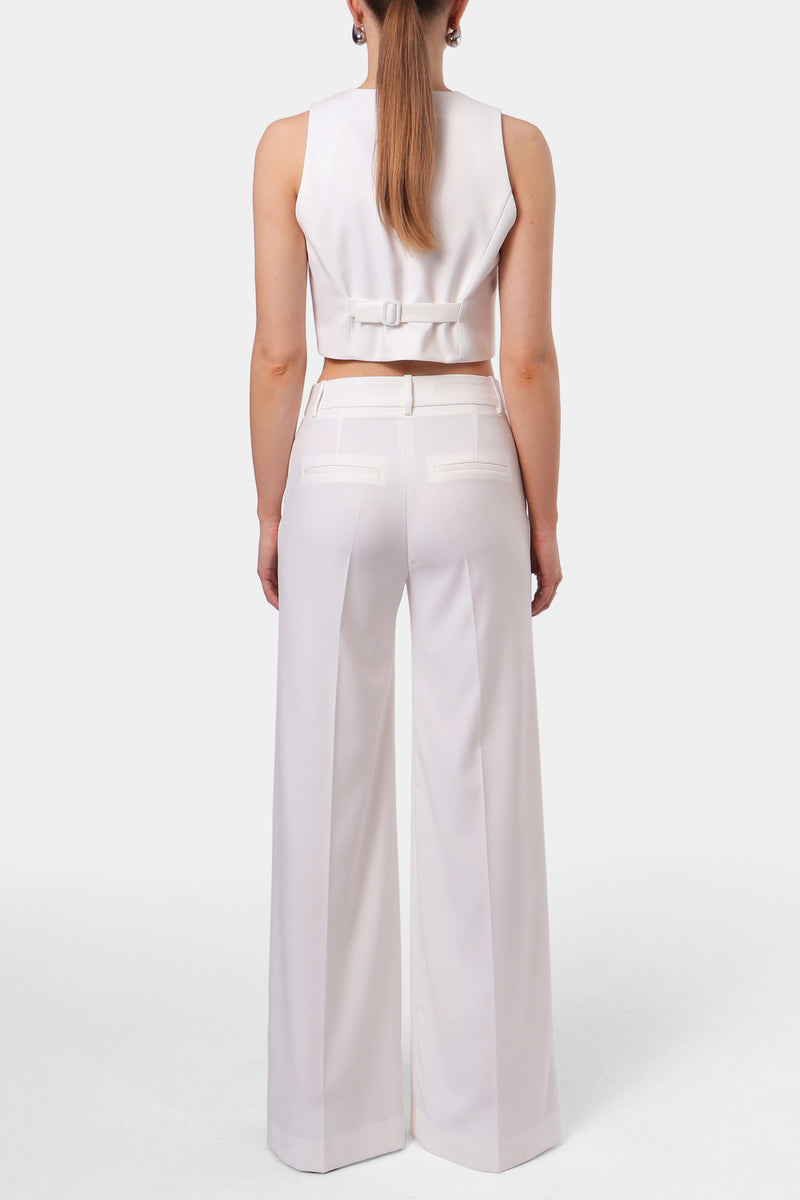 Off-white AGGI by HALEWSKI FRANZI pants with a relaxed fit and stylish design, shown in a front view.