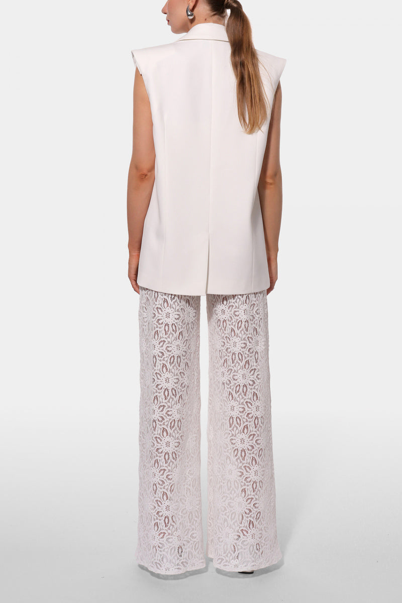 Off-white Ursula vest by AGGI by HALEWSKI, stylish tops featuring a modern design, shown on a model with a close-up view.