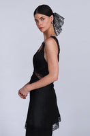 A large Aethera Branka sequined scrunchie with shiny silver sequins, designed for stylish hair accessories.