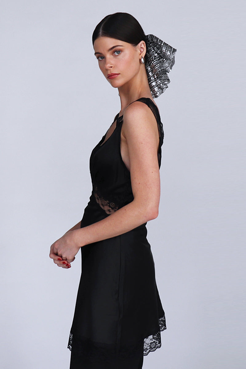 A large Aethera Branka sequined scrunchie with shiny silver sequins, designed for stylish hair accessories.