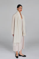 Aethera Helena cashmere shawl in white, draped elegantly to showcase soft, luxurious fabric and classic style.