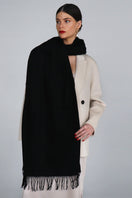 Aethera Helena cashmere shawl in Nero, showcasing a soft black cashmere scarf with elegant drape and luxurious texture.
