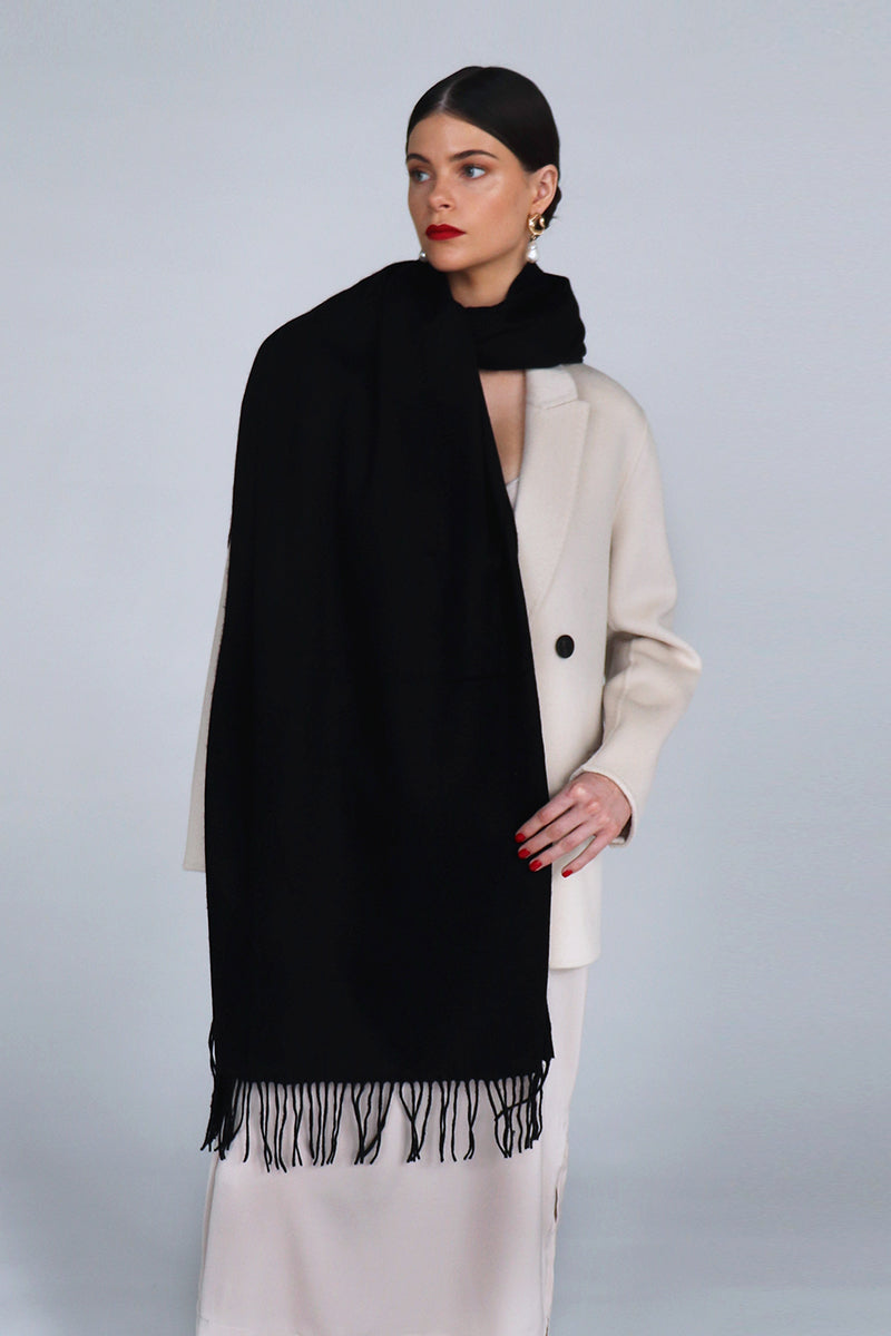 Aethera Helena cashmere shawl in Nero, showcasing a soft black cashmere scarf draped elegantly for stylish warmth.