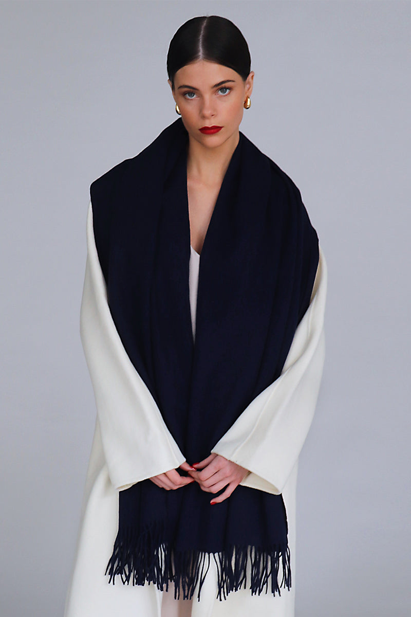 Aethera Helena cashmere shawl in nero, elegantly draped, showcasing soft black cashmere fabric perfect for stylish warmth.