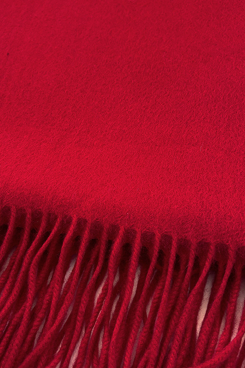 Aethera Serene Lambswool Shawl in crimson, showcasing its soft, woven texture and elegant drape in a close-up view.