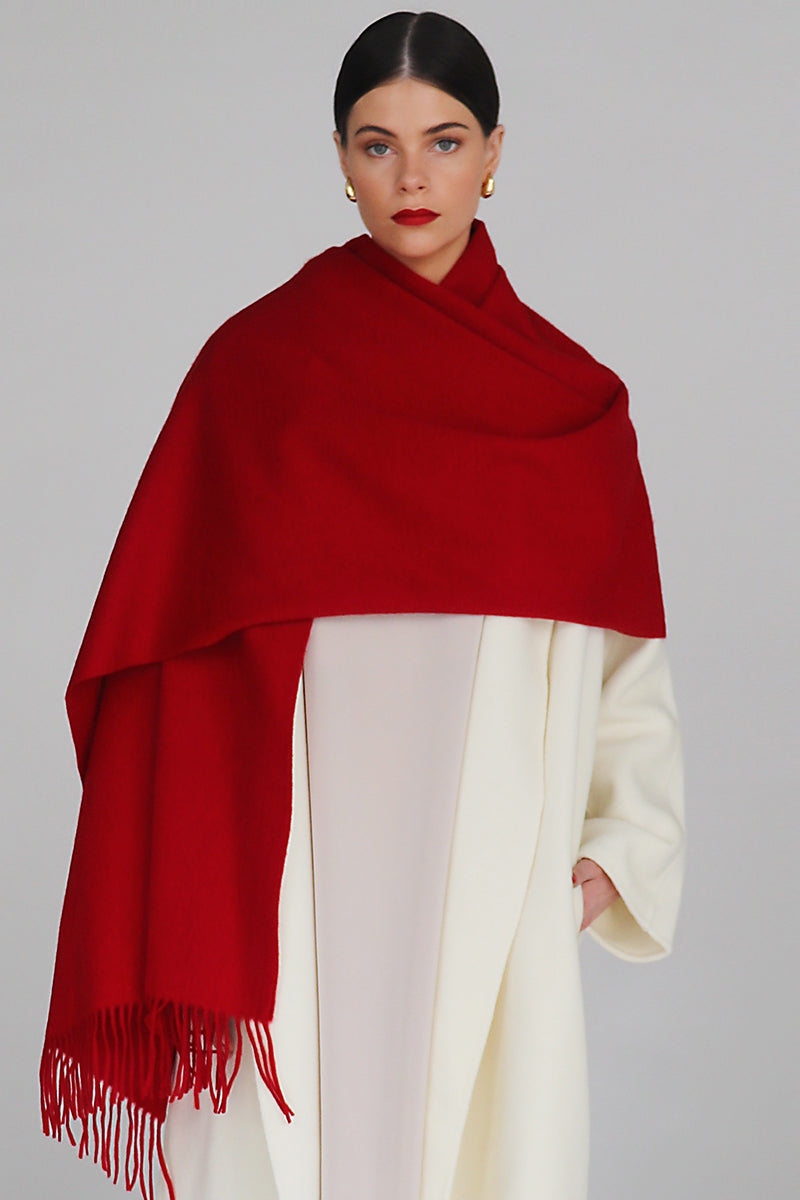 Aethera Serene lambswool crimson shawl draped elegantly, showcasing soft texture and vibrant color.
