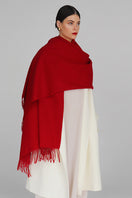 Aethera Serene Lambswool Shawl in crimson, soft and cozy scarf draped elegantly, highlighting its warm, luxurious texture.
