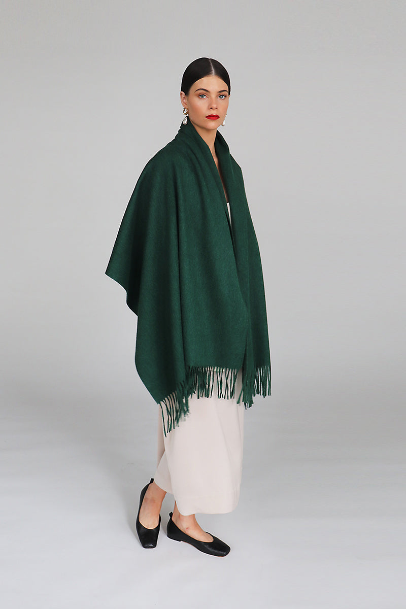 Aethera Serene lambswool shawl in vibrant chartreuse, draped elegantly to showcase its soft texture and cozy warmth.