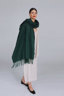 Aethera Serene lambswool shawl in vibrant chartreuse color, draped to showcase its soft, cozy texture and elegant design.