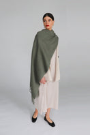 Aethera Serene Lambswool Shawl in soft celadon color, showcasing its cozy, lightweight texture and elegant drape.
