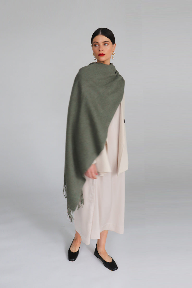 Aethera Serene Lambswool Shawl in soft celadon color, showcasing its cozy, lightweight texture and elegant drape.