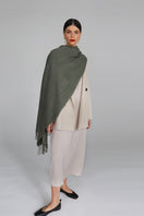 Aethera Serene Lambswool Shawl in soft celadon color, showcasing its lightweight, cozy fabric and elegant drape.