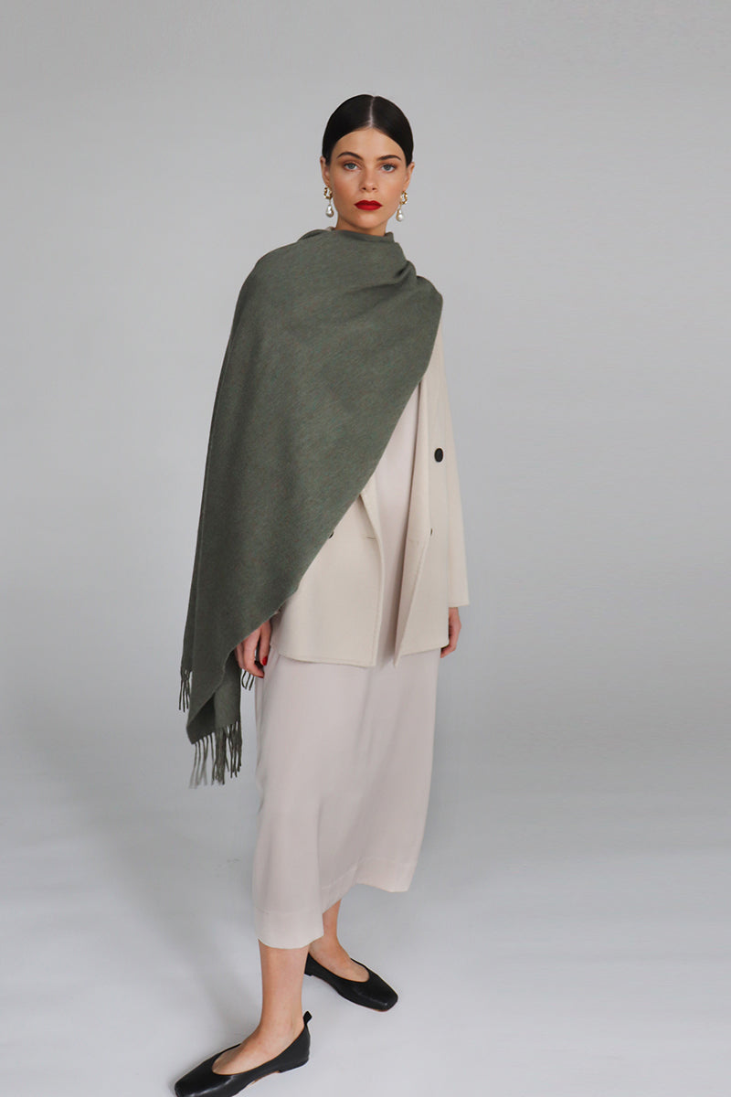 Aethera Serene Lambswool Shawl in soft celadon color, showcasing its lightweight, cozy fabric and elegant drape.
