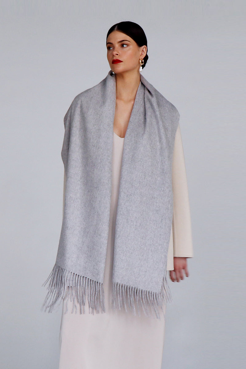 Aethera Helena cashmere shawl in marle, draped loosely to showcase soft, textured fabric and versatile style.