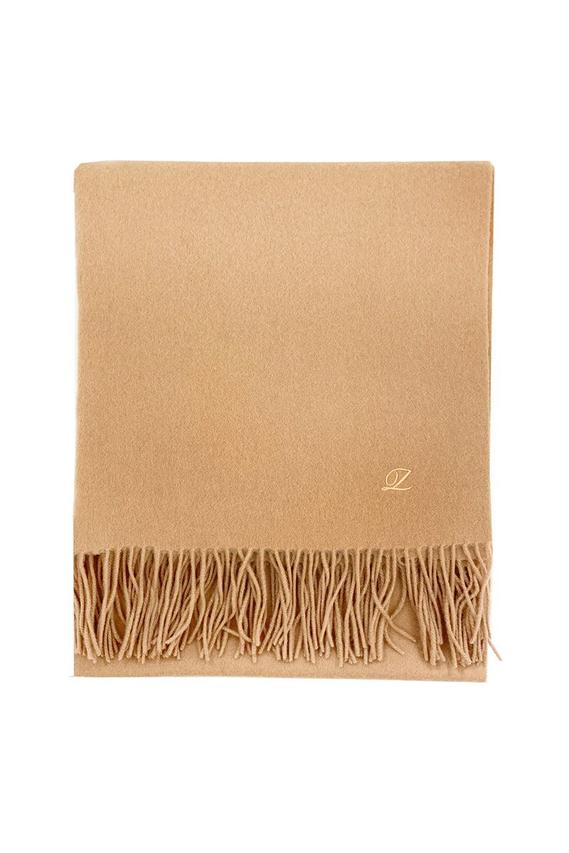 Aethera Helena cashmere shawl in camel color, draped to showcase soft, luxurious fabric and elegant design.