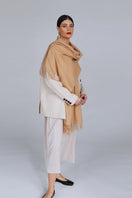 Aethera Helena cashmere shawl in warm camel color, draped elegantly to showcase soft, luxurious cashmere fabric and stylish design.
