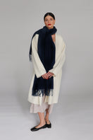 Navy Aethera Serene Lambswool Shawl draped over a mannequin, showcasing soft, cozy wool fabric and elegant design in a scarf and shawls image.