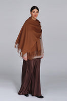 Aethera Helena cashmere shawl in birch color, draped gracefully to showcase soft cashmere fabric and elegant design.