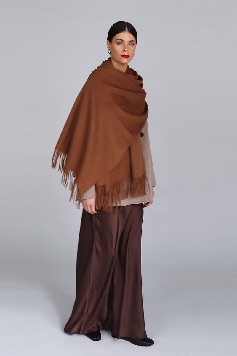 Aethera Helena cashmere shawl in birch color, draped gracefully to showcase soft cashmere fabric and elegant design.