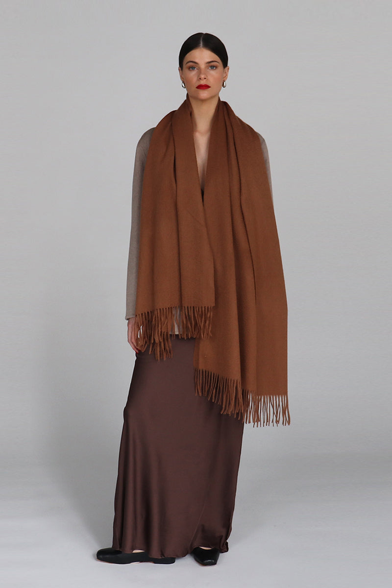 Aethera Helena cashmere shawl in birch color, soft and cozy, draped elegantly showing its luxurious fabric and delicate weave.