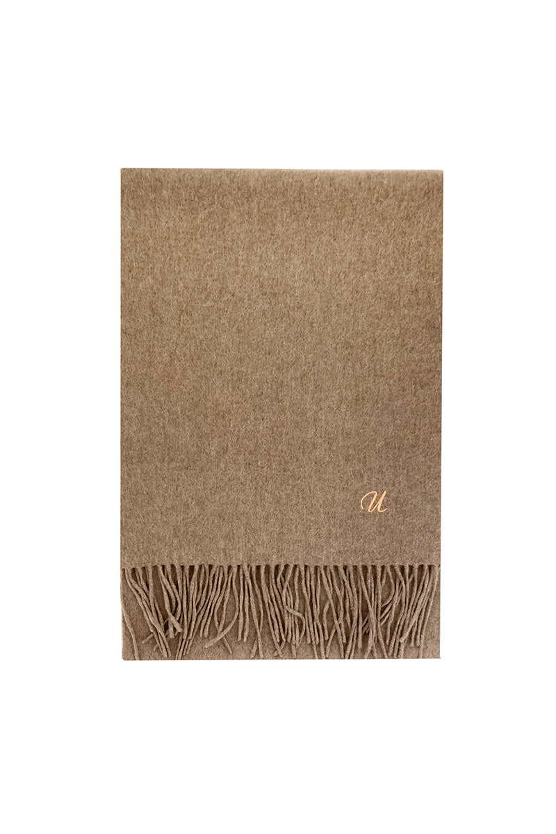 Aethera Ophelia cashmere scarf in light fawn, soft and cozy, draped elegantly to showcase its luxurious texture and subtle color.