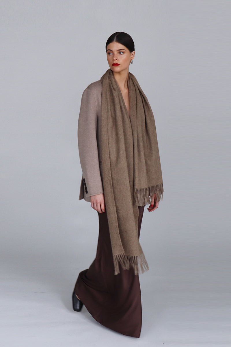 Aethera Ophelia cashmere scarf in light fawn, soft and cozy, draped to showcase its elegant, lightweight design.