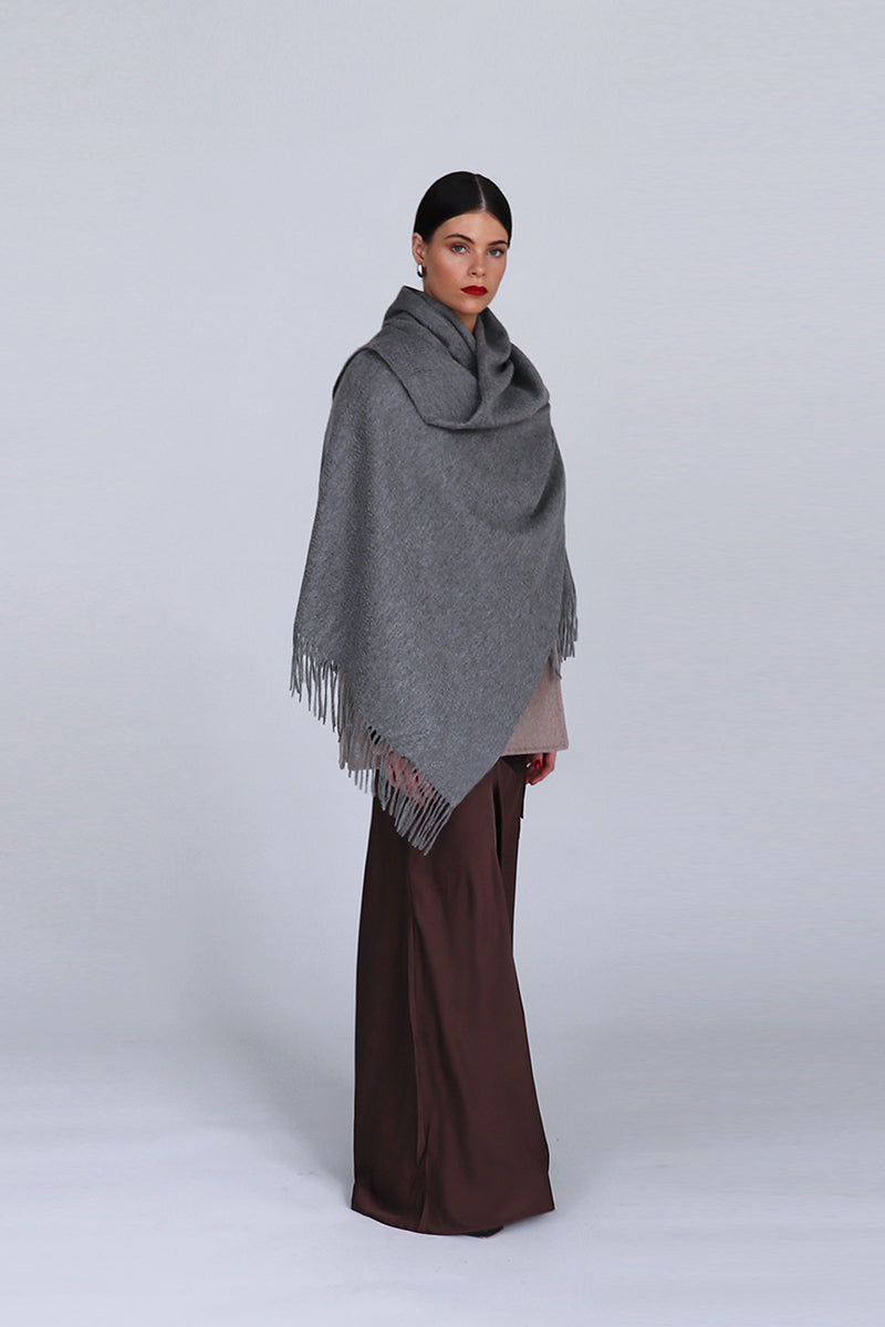 Aethera Helena cashmere shawl in steel color, showcasing soft, luxurious fabric draped elegantly for a stylish look.