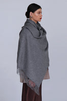 Aethera Helena cashmere shawl in steel color, draped elegantly to showcase soft, luxurious fabric and versatile scarf style.