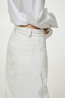 Milk-colored relaxed fit jeans by DELEGAN, showing a casual denim style with a comfortable, loose fit and classic pocket details.