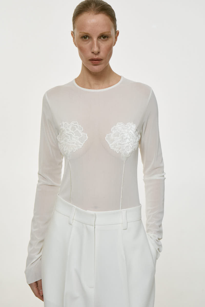 DELEGAN milk long sleeve embroidered top with intricate floral embroidery, lightweight fabric, and classic fit.