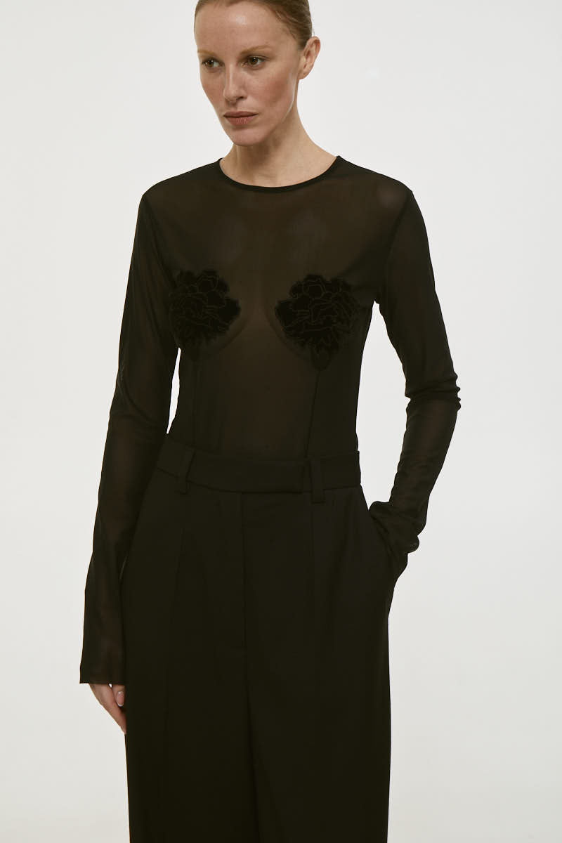Black long sleeve embroidered shirt by DELEGAN, featuring intricate embroidery and a fitted design.