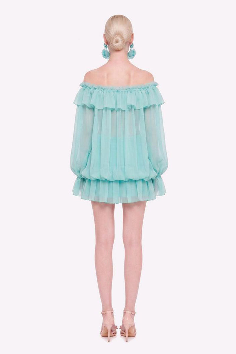 Valenciani off-shoulder mini dress styled as a scarf, featuring a stylish design and lightweight fabric, shown from the back.