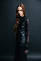 Black leather vest with belt by Vaska, stylish jacket featuring a sleek design and adjustable waist belt.