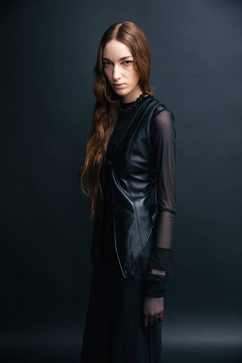 Black leather vest with belt by Vaska, stylish jacket featuring a sleek design and adjustable waist belt.