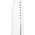 Izakova Dariana off-white maxi dress displayed on a hanger with flowing fabric and elegant design.