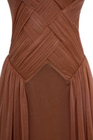 Beige sheer chiffon gown by EEGEN STUDIO with flowing fabric and elegant design, perfect for formal occasions.