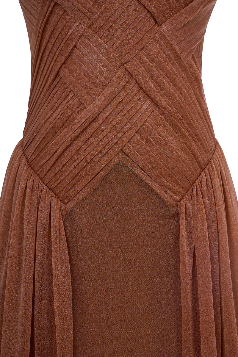 Beige sheer chiffon gown by EEGEN STUDIO with flowing fabric and elegant design, perfect for formal occasions.