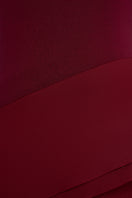 Red spandex jersey gown by EEGEN STUDIO, featuring a sleek, fitted design and elegant long sleeves.
