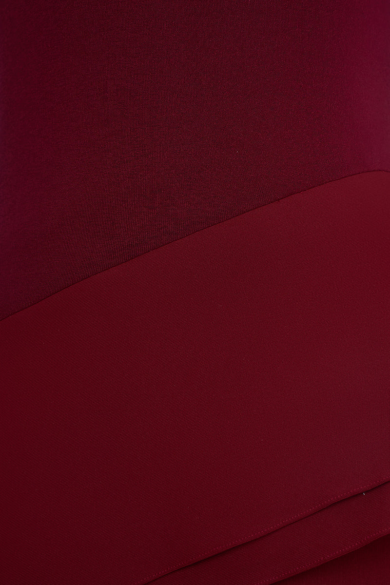 Red spandex jersey gown by EEGEN STUDIO, featuring a sleek, fitted design and elegant long sleeves.