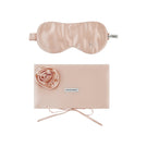Pink silk eye mask and matching pouch set from Not Just Pajama, soft and luxurious for home comfort and relaxation.