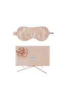 Pink silk eye mask and matching pouch set from Not Just Pajama, soft and luxurious for home comfort and relaxation.