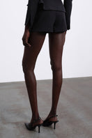 Black SÉLONE Elen double layer shorts with a stylish layered design, shown laid flat on a neutral background.