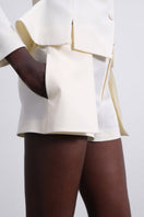 SÉLONE ELEN double layer white shorts with panel design, casual fit, and lightweight fabric, styled for a relaxed summer look.