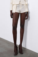 SÉLONE ELEN double layer white shorts with panel design, casual style, and comfortable fit.