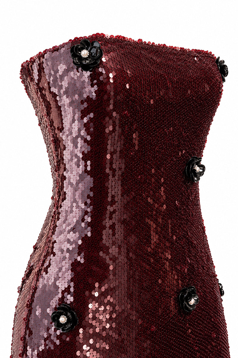 Urban Muse burgundy gown with elegant embroidery and flowing fabric, ideal for formal occasions.